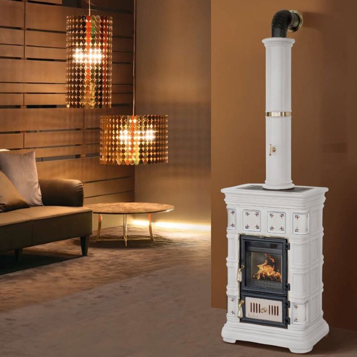 Печь Marlene Mini, bianco + decoro D1 (Sergio Leoni) Итальянская компания Sergio Leone представляет вниманию россиян новинку своей коллекции печей 2012-2013 года. На этот раз талантливые итальянские дизайнеры и конструкторы разработали модель изумительного винтажного стиля, который сейчас находится на пике моды и популярности. Стиль «винтаж», или стилизация «под старину», демонстрирует нам изысканную, предельно гармоничную печь, внешний вид и пропорции которой продуманны до мелочей, чтобы удовлетворить вкусы самых претенциозных зрителей. Центральным элементом дизайна этой модели, несомненно, выступает ностальгическая керамическая облицовка чистого белого цвета, с плавно закругленными гранями, изразцовыми декоративными геометрическими фигурами. Дополнением облицовки выступает грациозная керамическая колонна, обрамляющая дымоход. Модель печи исполнена, помимо керамики, элементами из чугуна и благородной латуни. Оптимальная мощность печи позволяет наполнять комфортным и продолжительным теплом помещения до 220 м3. Варианты исполнения:,Дополнительно:,Хотите купить печи? Домотехника - большой выбор печей и каминов!